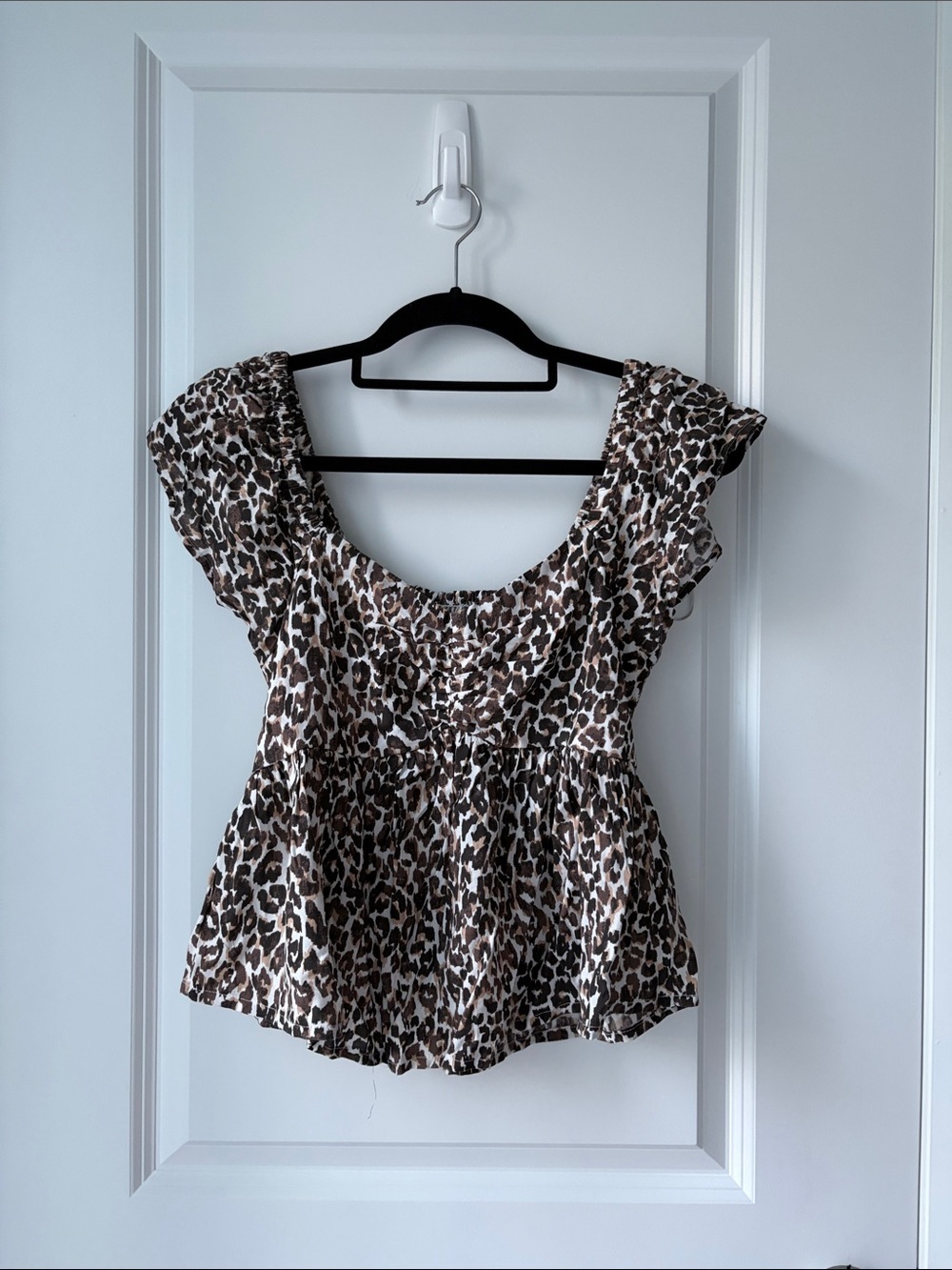 JAPNA Cheetah Print Peplum Blouse with Ruffled Cap Sleeves